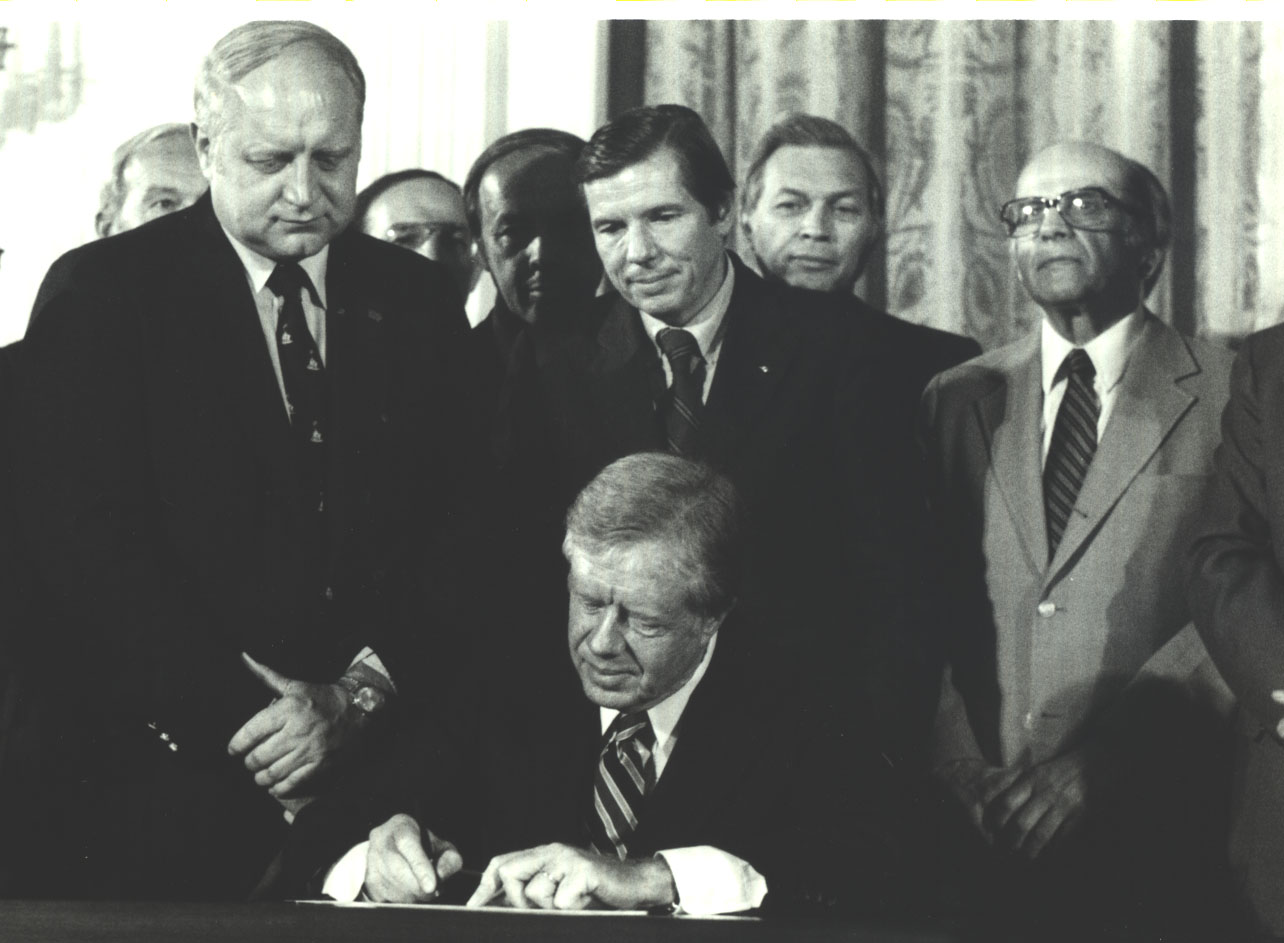 Culver with President Carter at the signing of the Regulatory Flexibility Act, November 1979